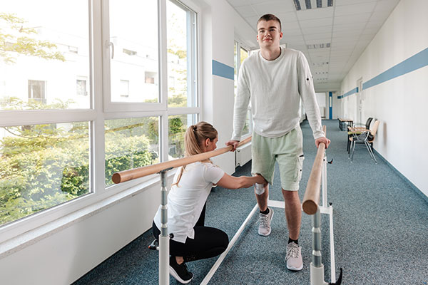 Physiotherapist working with a patient post surgery